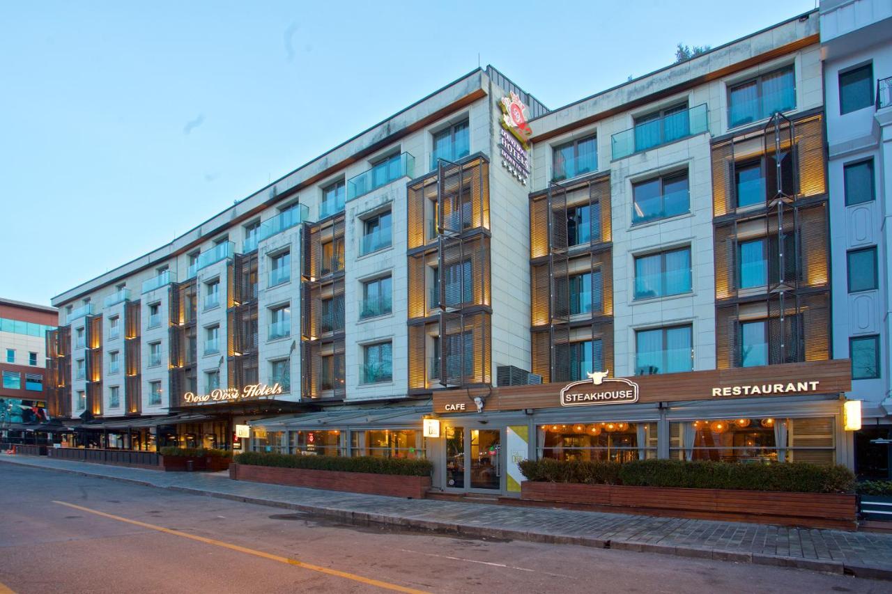 Dosso Dossi Hotels & Spa Downtown Istanbul Exterior photo The photo shows a modern hotel building with multiple stories. The façade features a mix of glass and concrete elements, giving it a sleek and contemporary look. There are several large windows across the building, allowing for plenty of natural ligh